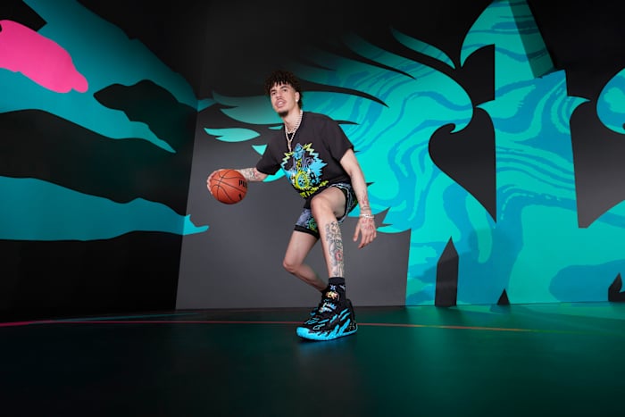 LaMelo Ball models black and blue PUMA apparel.